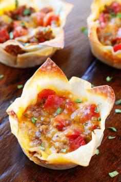 These fun Crunchy Taco Cups are made in a muffin tin with wonton wrappers! Great for a taco party/bar. Everyone can add their own ingredients and toppings! Crunchy, delicious, and fun to eat!