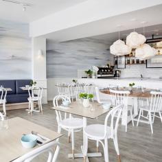 
                    
                        Tall diners will literally have their heads in the clouds, as Pollock has extended the mural into three dimensions with sculptural cumulus light fittings. The fresh white continues in chairs, tiling and panel paintwork, with colour introduced via the wooden tabletops and deep blue banquette...
                    
                