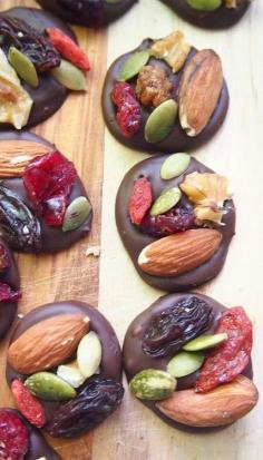 
                    
                        2 Ingredient Organic Dark Chocolate Trail Mix Energy Bites; gorgeous idea; dollop of chocolate, drop on any whole food toppings and let cool
                    
                
