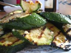 
                    
                        Grilled Zucchini complemented with shallots and a hint of garlic makes a wonderful, inexpensive and healthy side dish accompaniment with any meal.
                    
                