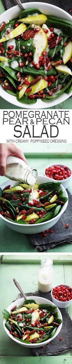 Pomegranate Pear Pecan Salad: Fresh spinach salad topped with pomegranate seeds, crisp pears, crunchy pecans, feta cheese, and creamy poppyseed dressing.