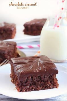 Double Chocolate Coconut Cake | Rich as a brownie but with a cake texture, this double chocolate coconut dessert is bursting with coconut flavor from both the coconut extract and coconut flakes!