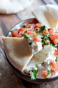 Garlic Feta Dip. This creamy, tangy dip goes great with pita and is easy to whip together as a party appetizer!