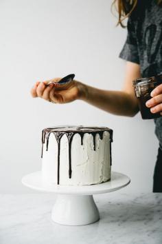 
                    
                        layered vanilla cake with buttercream frosting and chocolate ganache
                    
                