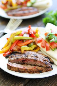 
                    
                        Grilled Steak Fajitas Recipe on twopeasandtheirpo... Get out the grill and make these easy and delicious fajitas for dinner! Serve with tortillas and your favorite toppings!
                    
                