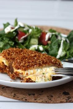 jalapeno popper chicken - Jalapeño Popper Chicken  Serves 2. 1/2 cup panko, 2 tsp. canola oil, 1.5 – 2 tsp. taco seasoning, 1 egg, 2 oz. reduced fat cream cheese, 1/4 cup shredded cheddar cheese (we used 2%), 1-2 jalapeño peppers, seeds and ribs removed, minced, 2 chicken breasts.  Preheat the oven to 375 and place an ovenproof rack onto a rimmed baking dish. Spray with cooking oil.In a small skillet over medium heat, combine the panko with the canola oil. Cook, stirring often, until the panko is golden and crispy. Place in a shallow bowl or dish. To the panko, add the taco seasoning* and stir to combine.In another shallow bowl or dish, lightly beat an egg. In a small bowl, combine the cream cheese, cheddar cheese, and jalapeños.Using a small utility knife, cut a pocket into the side of each chicken breast, or horizontally slice the chicken through the center, until it is almost butterflied. Season the chicken lightly with salt and pepper, and then divide the cream cheese mixture evenly between each chicken breast’s pocket. Use toothpicks to secure, if necessary.Dip the chicken pieces one at a time first into the egg, and then into the panko mixture, making sure to coat the chicken completely. Place the chicken on the prepared baking rack and cook for about 25-30 minutes, or until chicken is cooked through.