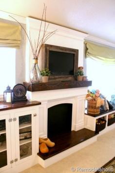 reclaimed wood framed TV with mantel to hide the cords (Remodelaholic)