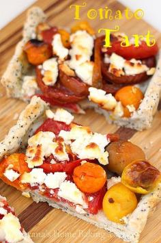 Tomato tart with poppy seed crust and goat cheese – buttery poppy seed and thyme crust, colorful cherry and kumata tomatoes and crumbled goat cheese