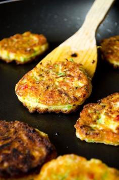 Paleo adaptable recipe for Zucchini fritters with carrot, red bell pepper and feta. A great twist on classic zucchini fritters. A perfect treat for parties! You can even make vegetarian burgers with these. | giverecipe.com | #fritters #zucchini #partyfood