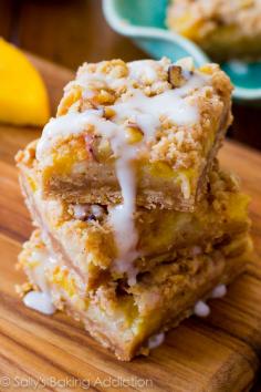 Peaches 'n Cream Bars Recipe ~ A four layered bar with a brown sugar/oat crust, topped with a creamy peach filling, pecan streusel, and finished off with luscious vanilla glaze.