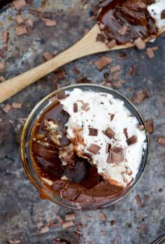 baileys chocolate mousse with whiskey caramel sauce and whipped cream.