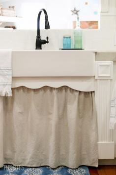 Farmhouse sink and skirt in the kitchen.