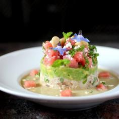 Crab salad is topped with avocado with lime, which is topped with watermelon, feta, mint and an edible floral garnish. I think I'd make this as a salad and not a soup