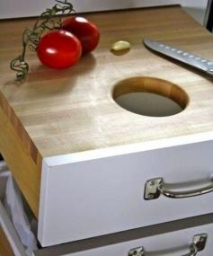 Great idea to have a cutting board built in with a hole to the garbage.