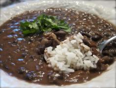Pinners say: Best Ever Black Bean Soup 2 cans of seasoned black beans (drained, not rinsed) 1 can chicken broth 1 1/2 cups water 2 Tbsp olive oil 1 cup chopped onion 2 cloves of garlic minced 2 tsp chili powder 1/4 tsp cumin White Rice