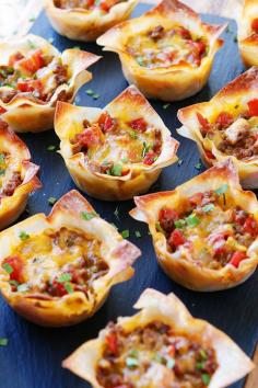 These fun Crunchy Taco Cups are made in a muffin tin with wonton wrappers! Great for a taco party/bar. Everyone can add their own ingredients and toppings! Crunchy, delicious, and fun to eat!