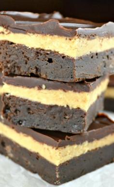 Dark Chocolate Peanut Butter Truffle Brownies...Fudgy, Rich, & Decadent Chocolate Brownies with a Creamy Peanut Butter Filling and Dark Chocolate Peanut Butter Ganache! These are Insanely Delicious!