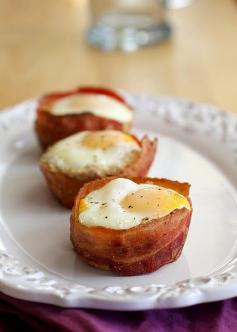 COMPLETE. Breakfast Cups. Eggs, bacon, toast, and cheese. Using a muffin tin: Bread first, wrap bacon around the outside, sprinkle cheddar cheese on top of the bread slices, crack one egg into each muffin cup. Bake for 10-15 minutes at 400 degrees.