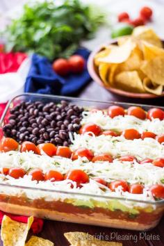 This Lightened Up 7 Layer Dip is the perfect party food. By replacing sour cream with hummus and using reduced fat cheese, you save on calories without sacrificing flavor!