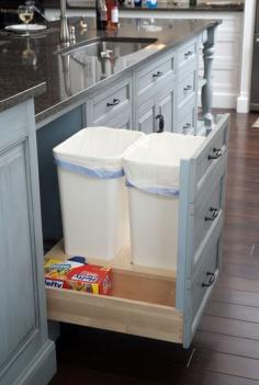 Formal white kitchen with blue island - Mullet Cabinet traditional kitchen gotta store trash bins away