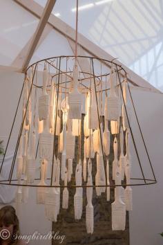 Cute idea for a craft room: homemade quirky chandelier. dip paint brushes and use them in a chandelier. Image captured at  the "Woonbeurs Amsterdam" a residential living event