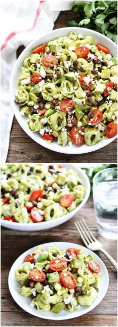 Mexican Tortellini Salad...cheese tortellini with black beans, tomatoes, corn, avocado, cotija cheese, and a simple cilantro vinaigrette. This easy pasta salad is great as a main dish or side dish.
