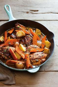 Braised Chicken Thighs with Carrots, Potatoes and Thyme | Fresh herbs and sweet carrots update this old-fashioned skillet dinner. Serve with a side of homemade cornbread for a meal that feels homey and special -- perfect for fall. Braised Chicken T...