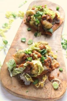 Delicious fusion tostadas with beer battered avocado, drunken mushrooms, slaw and peanut sauce.