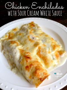 Chicken Enchiladas with Sour Cream White Sauce  Make with Rotisserie chicken, tortillas, canned chili's and cheese.  Note: corn tortillas will fall apart during cooking, use flour.