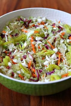 
                    
                        Greek Style Cole Slaw: a lighter, non-mayo based coleslaw recipe with feta cheese and a lemon-oregano vinaigrette.  Nutritional information and Weight Watcher's points included.
                    
                