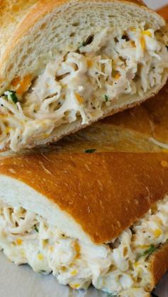 
                    
                        Chicken Stuffed French Bread ~ French bread stuffed with a flavorful chicken mixture... Packed full of flavor with the chicken, ranch dressing, loads of cheese and green onion
                    
                