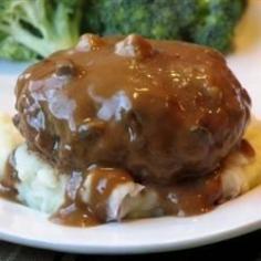 Slow Cooker Salisbury Steak | "Ground beef gets a boost of flavor from onion soup mix in this quick and easy slow cooker Salisbury steak recipe."