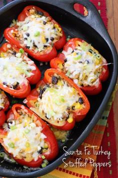 Santa Fe Turkey Stuffed Peppers Santa Fe inspired stuffed bell peppers loaded with a zesty filling of ground turkey, corn, black beans, hot peppers and tomatoes, topped with melted cheese and scallions.