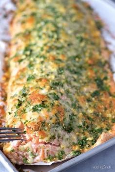 Baked Salmon with Parmesan Herb Crust Recipe  Baked salmon makes a weeknight meal that is easy enough for the busiest of nights while being elegant enough for entertaining. This oven baked salmon with a Parmesan herb crust is out of this world delicious!