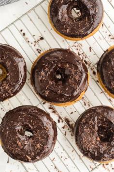 These baked doughnuts are made with sprouted spelt flour to give a bit of flavor to the doughnut and topped with an easy chocolate ganache. @NaturallyElla