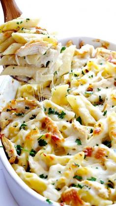 This Chicken Alfredo Baked Ziti recipe is great! You make your Alfredo sauce from scratch and bake it in fresh-made pasta, chicken, and other goodies. Serve it to your friends, and they'll be asking for several helpings!