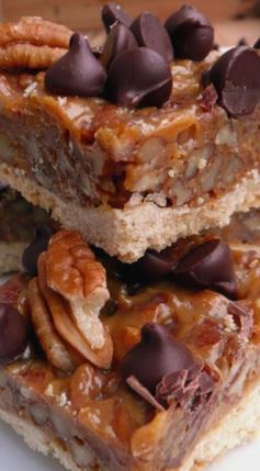 CHOCOLATE CARAMEL PECAN BARS  ~  3 c. pecans, roughly chopped  -  CRUST  -  1 c. flour...1 c. white whole wheat flour...2/3 c. powdered sugar...3/4 c. cold butter, cut in small bits...FILLING  -  1 (14-oz.) can dulce de leche (here's a recipe from The Fountain Avenue Kitchen to make it in the slow cooker)...2 t. vanilla extract...1/4 - 1/2 t. salt...2 T. butter, melted...Milk or fat-free half & half, as needed to thin the caramel...1 c. semi-sweet or dark chocolate chips