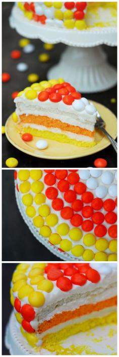Make a Candy Corn Layer Cake for your Halloween Party. It's easy to make and covered with candy corn M&M's. When you slice it, you can see all the layers!