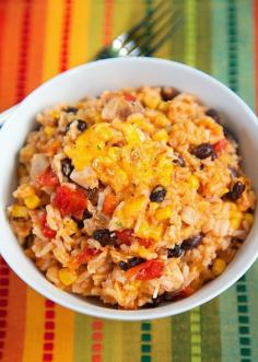 
                    
                        Chicken Enchilada Rice Bake Recipe - chicken, black beans, corn, Rotel tomatoes, cheese, rice and enchilada sauce! SO good! I wanted to eat the whole pan! Use rotisserie chicken and this is ready for the oven in 10 minutes. Super quick Mexican dinner recipe.
                    
                