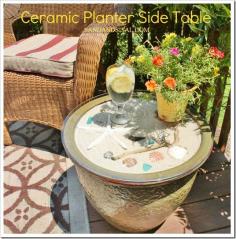 fill a ceramic planter with pool filter sand. Arrange shells and other little items as decoration. Add a glass top. Voila! Patio table.