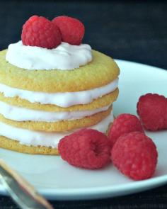 
                    
                        Bright Lemon Raspberry Cookie Stacks - a vibrant flavorful update on a classically retro recipe - bright lemon cookies stacked with cool raspberry whip cream! spabettie
                    
                