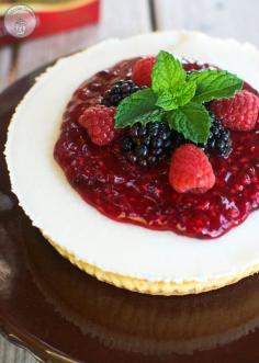 Classic Cream Cheesecake with Mixed Berry Sauce