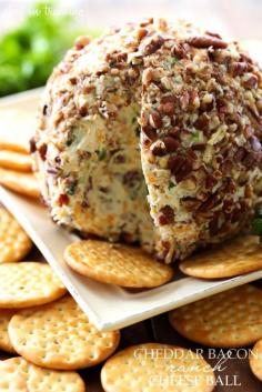 Cheddar Bacon Ranch Cheese Ball   Ingredients 16 ounces softened cream cheese 1 cup shredded sharp cheddar cheese 1 cup cooked and chopped bacon ⅛ cup DRY Ranch Dressing mix, you can use my homemade recipe (the kind with buttermilk powder) ¼ cup chopped green onions 1 cup chopped pecans  Instructions In medium bowl combine cream cheese, cheddar cheese, bacon, ranch mix, and green onions.  Mix well and form into a ball. Roll cheese ball in pecans and refrigerate for 1 hour before serving. Enjoy!