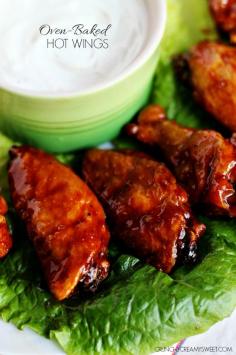 Oven-Baked Hot Wings - a healthier version for the hot wing lovers! Chicken wings baked in the oven to a crispy perfection and tossed in a sweet and spicy sauce. These wings are fantastic!  #recipe #snack crunchycreamysweet.com
