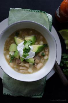 This White Bean and Chicken Chili recipe is our newest favorite! It's full of bites of tender chicken, creamy cannellini beans, hearty hominy with great spicy flavor! From @tasteLUVnourish on TasteLoveAndNourish.com