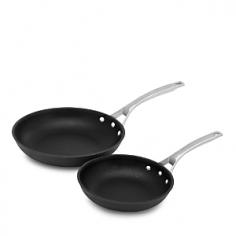 Fry Pans & Skillets - These 8 inch and 10 inch nonstick omelette pans feature durable "Sear" nonstick surface perfect for preparing eggs and omelettes, searing steaks, chicken breasts or seafood. With ultra-smooth surface, these nonstick skillets let you cook with little to no oil or butter for healthier entrees. The nonstick surface is so durable, you can cook with your favorite metal spatulas, spoons and whisks and easily flip sausages, hamburgers and heavier foods without scratching the surface. The convenience of two Calphalon fry pans in one set, 10 inch and 12 inch, feature wide, flat bottoms and an easy-release nonstick surface perfect for preparing grilled cheese sandwiches, hamburgers, potatoes or pork cutlets. The 12 inch fry pan includes tempered glass lid. Brushed stainless steel handles are riveted for durability and stay cool to the touch. Oven safe to 500 F. Lid with the 12 inch pan is oven safe to 400 F. Made in the USA. Dishwasher safe. Founded in 1963, Calphalon is a leading American manufacturer of professional quality cookware. Calphalon originated by supplying cookware to restaurants and commercial kitchens. Today, Calphalon offers a full range of cookware, bakeware and kitchen accessories to fit the culinary needs and styles of the home cook and professional chef. Product Features Calphalon hard anodized aluminum cookware conducts heat evenly to cook flawless eggs and omelettes, sear steaks or seafood "Sear" nonstick surface provides easy release for effortless cleanup Nonstick surface is durable to safely use metal, spatulas, spoons and whisks Brushed stainless steel loop handles stay cool to the touch Handles are riveted for durability 12 inch fry pan includes tempered glass lid PFOA-free interior Established in 1963, Calphalon is the culinary authority in kitchenware, dedicated to enhancing the home chef's experience during planning, prep work, cooking, baking and serving - Specifications Model: 1948259 Materials: hard anodized aluminum, nonstick interior, tempered glass lid (12" omelette pan) Lifetime manufacturer warranty Made in the USA 10" omelette pan 10 1/2" Dia. (18"L w/handles) x 3 1/2" H Base: 6" Dia. Weight: 2 lbs, 8 oz. 12" omelette pan with lid 12 1/2" Dia. (22 1/2"L w/handle) x 4"H (w/lid) Base: 7 1/2" Dia. Weight: 3 lbs, 8 oz. Care and Use Dishwasher safe Suitable for gas, electric, ceramic and halogen cooktops Pan is oven safe to 500 F Lid is oven safe to 400 F