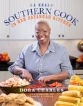 Dora Charles is the real deal, and hers may be the most honest - and personal - southern cookbook I've ever read." - John Martin Taylor In her first cookbook, a revered former cook at Savannah's most renowned restaurant divulges her locally famous Savannah recipes-many of them never written down before-and those of her family and friends Hundreds of thousands of people have made a trip to dine on the exceptional food cooked by Dora Charles at Savannah's most famous restaurant. Now, the woman who was barraged by editors and agents to tell her story invites us into her home to taste the food she loves best. These are the intensely satisfying dishes at the heart of Dora's beloved Savannah: Shrimp and Rice; Simple Smoky Okra; Buttermilk Cornbread from her grandmother; and of course, a truly incomparable Fried Chicken. Each dish has a "secret ingredient" for a burst of flavor: mayonnaise in the biscuits; Savannah Seasoning in her Gone to Glory Potato Salad; sugar-glazed bacon in her deviled eggs. All the cornerstones of the Southern table are here, from Out-of-This-World Smothered Catfish to desserts like a jaw-dropping Very Red Velvet Cake. With moving dignity, Dora describes her motherless upbringing in Savannah, the hard life of her family, whose memories stretched back to slave times, learning to cook at age six, and the years she worked at the restaurant. "Talking About" boxes impart Dora's cooking wisdom, and evocative photos of Savannah and the Low Country set the scene.