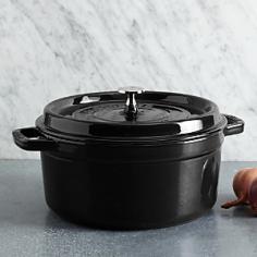 The French oven is a timeless standby for stews, roasts, soups, casseroles and other one-pot classics. Staub has perfected this tradition with their signature La Cocotte French Oven, the choice of some of the worlds best chefs. Staub's traditional round design has self-basting spikes for continuous, natural basting. When your meal is ready, La Cocotte moves beautifully from the stove to your table. Its black matte enamel coatings make it indestructible and highly chip resistant and also keep it from discoloring. The cast iron cookware retains the heat beautifully, keeping the dish warm long after it's been taken out of the oven or off the stove. Staub's attractive appearance make it possible for the dish to go straight from the stove to the table. Features: Made in France and developed in conjunction with France's most celebrated, world renowned chef Paul BocuseTight fitting flat lid features self-basting spikes for continuous, even distribution of juices throughout cooking, so food is moist and flavorful. Smooth bottom is suitable for use on any cooking surface, including induction. Interior black matte enamel finish produces a natural non stick surface that is more resistant to scratches and chips. It won't discolor or rust and never needs seasoning. Oven Safe up to 500FDishwasher safe The Staub journey begins in the Alsace region of France. Rich in history, food and craft, the area is renowned for hearty one-pot recipes and fine enameled ceramics. With as much attention as the Alsatians applied to perfecting the one-pot meal, Staubs founder set himself to perfecting the pot itself. The grandson of a cookware merchant, Francis Staub designed his first enameled pot in an old artillery factory in 1974, merging cast irons utility with the latest technology available. Today the success of these designs has become the benchmark for enameled cast iron cookware and is the reference brand for some of the worlds great chefs including Paul Bocuse. The winning result is French enam