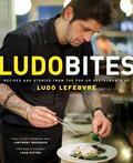The cookbook chronicles of the visionary, charismatic chef Ludo Lefebvre and his cult hitpop-up restaurant, LudoBites, worshiped by critics and foodies alike. Ludo Lefebvre is a culinary prodigy who worked at his first three-star Michelin restaurant at age fourteen. By twenty-five he was running his own kitchen in Los Angeles-winning accolades for serving the most imaginative, forward-thinking food the city had ever seen. In 2007, he traded fine dining-with its endless pomp and bottomless resources-for the freedom to cook outside the box, even if it meant sacrificing his skilled kitchen brigade and drafting an eight-year-old to clean green beans and separate eggs. The result was LudoBites, a "touring" restaurant that, like a rock 'n' roll band, roved the streets of Los Angeles, playing to different sold-out crowds every four months, bringing together old-money customers with a new generation of ambitious eaters who cram in elbow to elbow and cheek to cheek for the chance to sample Lefebvre's inspired, wildly imaginative food. LudoBites is the chronicle of that journey. Each chapter showcases the story and the outrageously inventive food of the seven different LudoBites incarnations, featuring recipes that merge the techniques Lefebvre perfected in his years at the finest French restaurants with the simplicity forced upon him by the limits of a pop-up kitchen. Essays prefacing each chapter give an unprecedented glimpse into the mind of "the chef of the future" (Time), a culinary genius who breaks all the rules, and beautiful, full-color photographs offer behind-the-scenes glimpses of the pain, drama, and triumph inherent in his creative process. As innovative and inviting as the unique chef it captures, LudoBites is a fascinating look at food and a revolutionary new way of cooking.