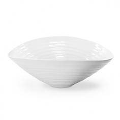 Made of sturdy porcelain. Modern, organic styling and ridges. Round salad bowl. Microwave- and dishwasher-safe. Available in a variety of sizes. A salad served in the Sophie Conran White Salad Bowl is a sight to behold. This stylish, yet sturdy porcelain bowl will highlight each ingredient. Simple salads will never be the same. Plus, it's safe for the freezer, oven, microwave and dishwasher. About PortmeirionStrikingly beautiful, eminently practical, refreshingly affordable. These are the enduring values bequeathed to Portmeirion by its legendary co-founder and designer, Susan Williams-Ellis. Her father, architect Sir Clough Williams-Ellis, was the designer of Portmeirion, the North Wales village whose fanciful architecture has drawn tourists and artists from around the world (including the creators of the classic 1960s TV show The Prisoner). Inspired by her fine arts training and creation of ceramic gifts for the village's gift shop, Susan Williams-Ellis (along with her husband Euan Cooper-Willis) founded Portmeirion Pottery in 1960. After 50+ years of innovation, the Portmeirion Group is not only an icon of British design, but also a testament to the extraordinarily creative life of Susan Williams-Ellis. The style of Portmeirion dinnerware and serveware is marked by a passion for both pottery manufacturing and trend-setting design. Beautiful, tactile, nature-inspired patterns are a defining quality of Portmeirion housewares, from its world-renowned botanical designs modeled on antiquarian books to the breezy, natural colors of its porcelain and earthenware. Today, the Portmeirion Group's design legacy continues to evolve, through iconic brands such as Spode, the Pomona Classics collection, and the award-winning collaboration of Sophie Conran for Portmeirion. Sophie Conran for Portmeirion: Successful collaborations have provided design inspiration throughout Sophie Conran's life. Her father, designer Sir Terence Conran, and mother, food writer Caroline Conran, have been the pillars of her eclectic mix of cooking, writing, and interior design. In pairing with the iconic British housewares brand Portmeirion, Conran has created another successful collaboration: Sophie Conran for Portmeirion, an award-winning collection of dinnerware, serveware, and drinkware for the practical, multi-functional needs of contemporary kitchens. Launched in 2006, Sophie Conran for Portmeirion immediately received the Elle Deco Style Award for Best in Kitchens, and two years later, the House Beautiful Award for Best in Tableware. The soulful, tactile beauty of these oven-to-tableware pieces is exemplified by rippled surfaces and edges that evoke a potter's hand. This down-to-earth style is complemented by charming pastels, gentle earth tones, and classic whites and pinks, for a collection that will lighten and enliven contemporary kitchen decors. Though delicate to the eye and touch, these plates and bowls are built for durable performance, with microwave- and dishwasher-safe porcelain that's casual enough for breakfast and elegant enough for eye-catching dinners. Size: Medium.
